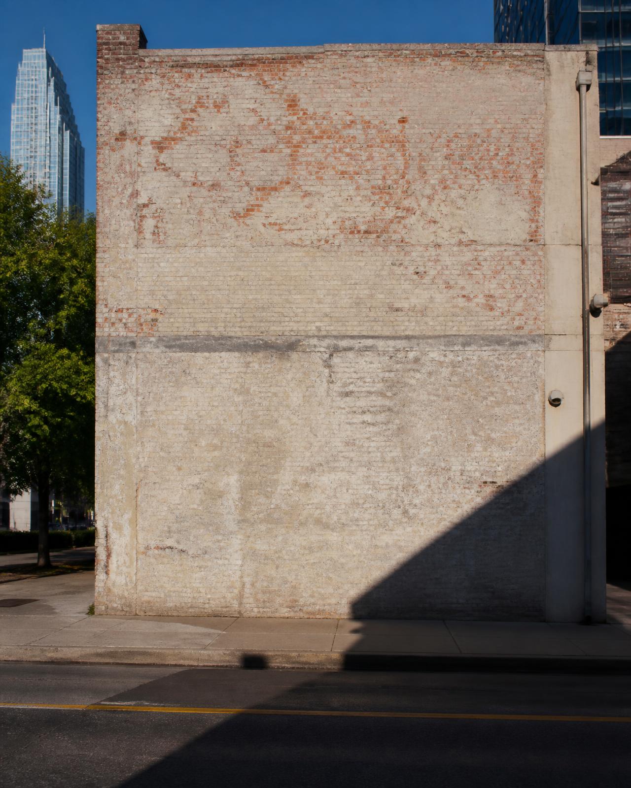 A blank brick and concrete wall on an Atlanta street